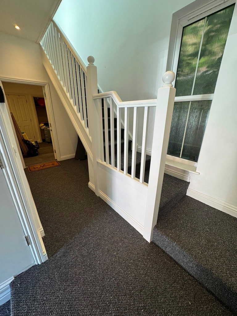 Lot: 113 - SIX FLATS FOR INVESTMENT - New carpet fitted in communal hallway at James House